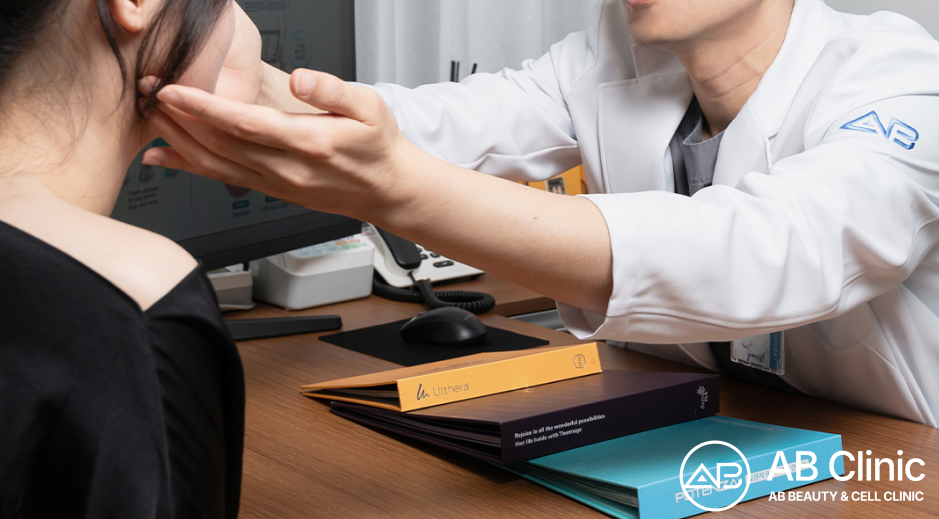 AB Clinic doctor assessing facial skin to create a personalized rosacea treatment plan